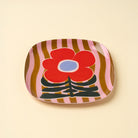 Poppy Pattern Enameled Tray on a beige background at Addison West