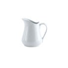 A white porcelain creamer pitcher with a handle and spout, against a plain background.