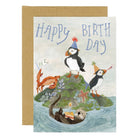 Illustrated happy birthday greeting card with muffins and crab and otter on a white background