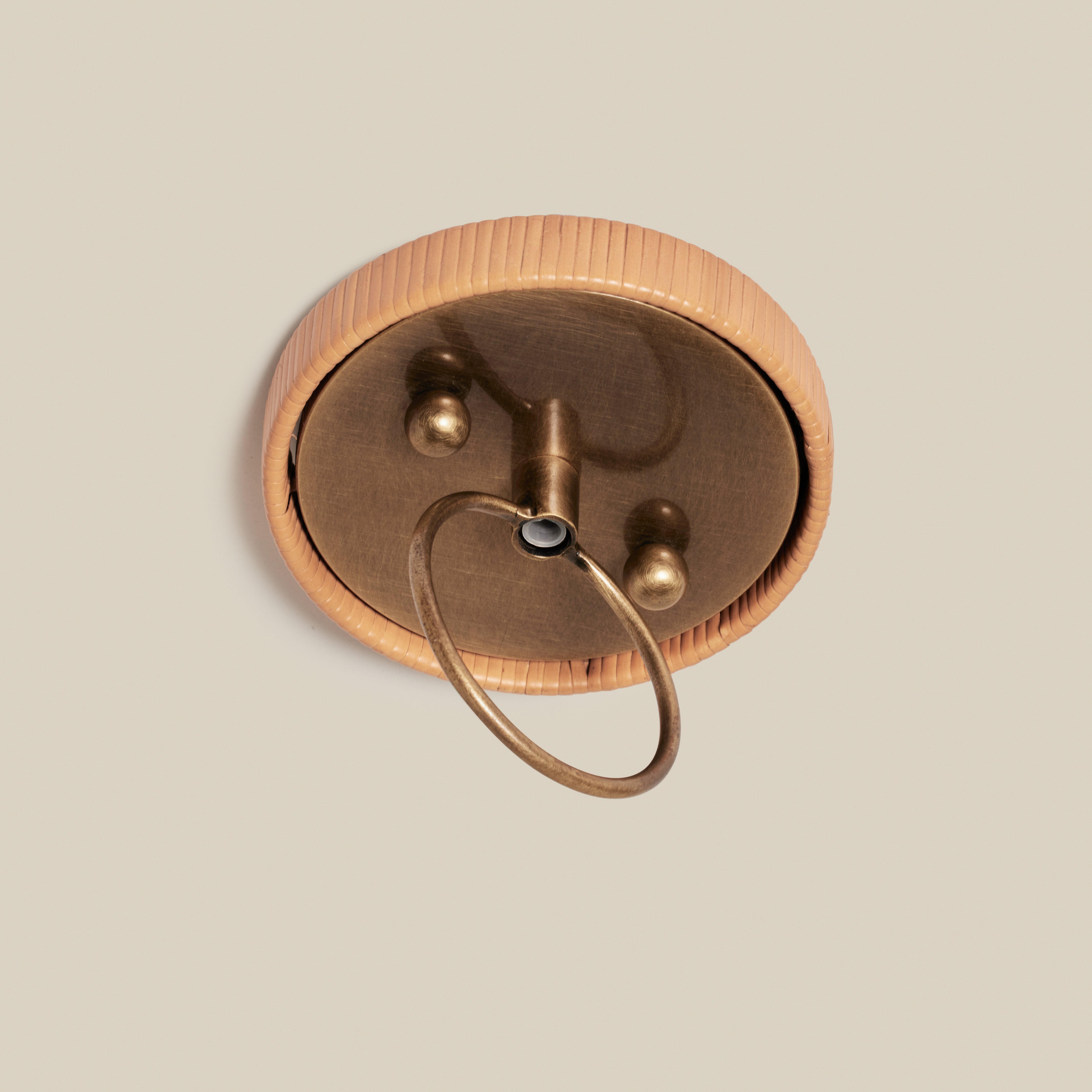 Close up of Delphine Large Chandelier on a beige background at Addison West