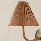 Delphine Sconce on a beige background