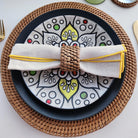Rattan Oval Napkin Rings, Set of 4 on a table at Addison West
