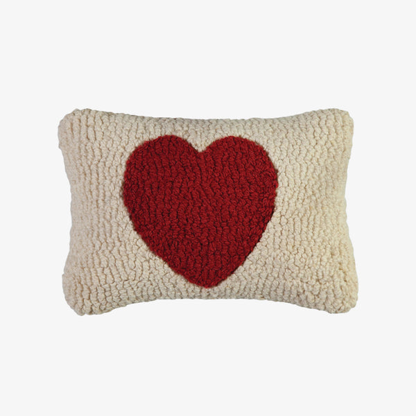 Chandler four corners hand hooked pillow with red heart on a white background