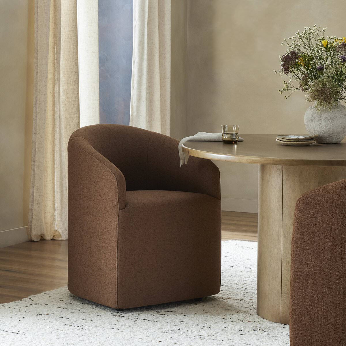 Four Hands Rhett Dining Chair in Bartin Rust in a dining room at Addison West