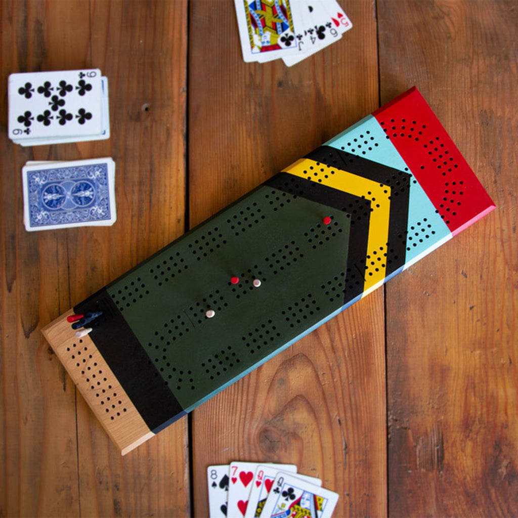 Sanborn Canoe Scout Cribbage Board on a wood table