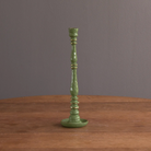 Beatriz Ball Medium Encanto Candlestick Holder in Leaf Green on a table at Addison West