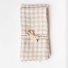 Set of two linen napkins in beige gingham on a white background