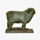 Patinad sheep weathervane statue on a white background