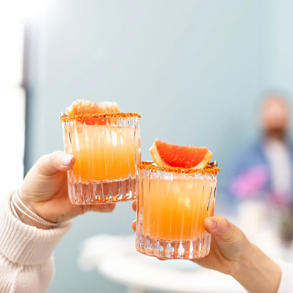 Simon Pearce Montpelier Double Old Fashioned, Set of 2 held by models at Addison West