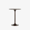 Antique rust colored 'Simone' metal bar height tulip table by four hands furniture on a white background