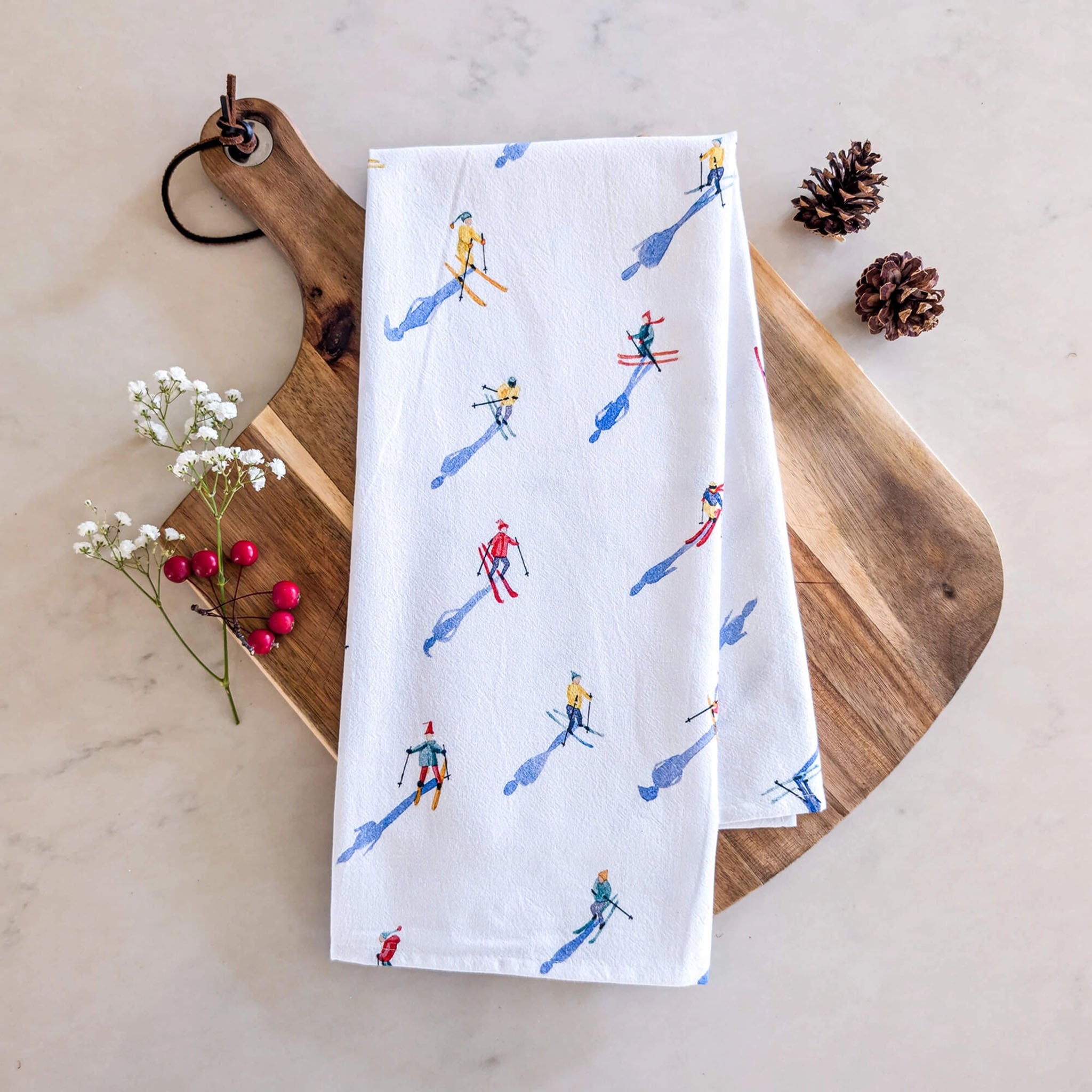 Skiers Tea Towel on a kitchen table at Addison West