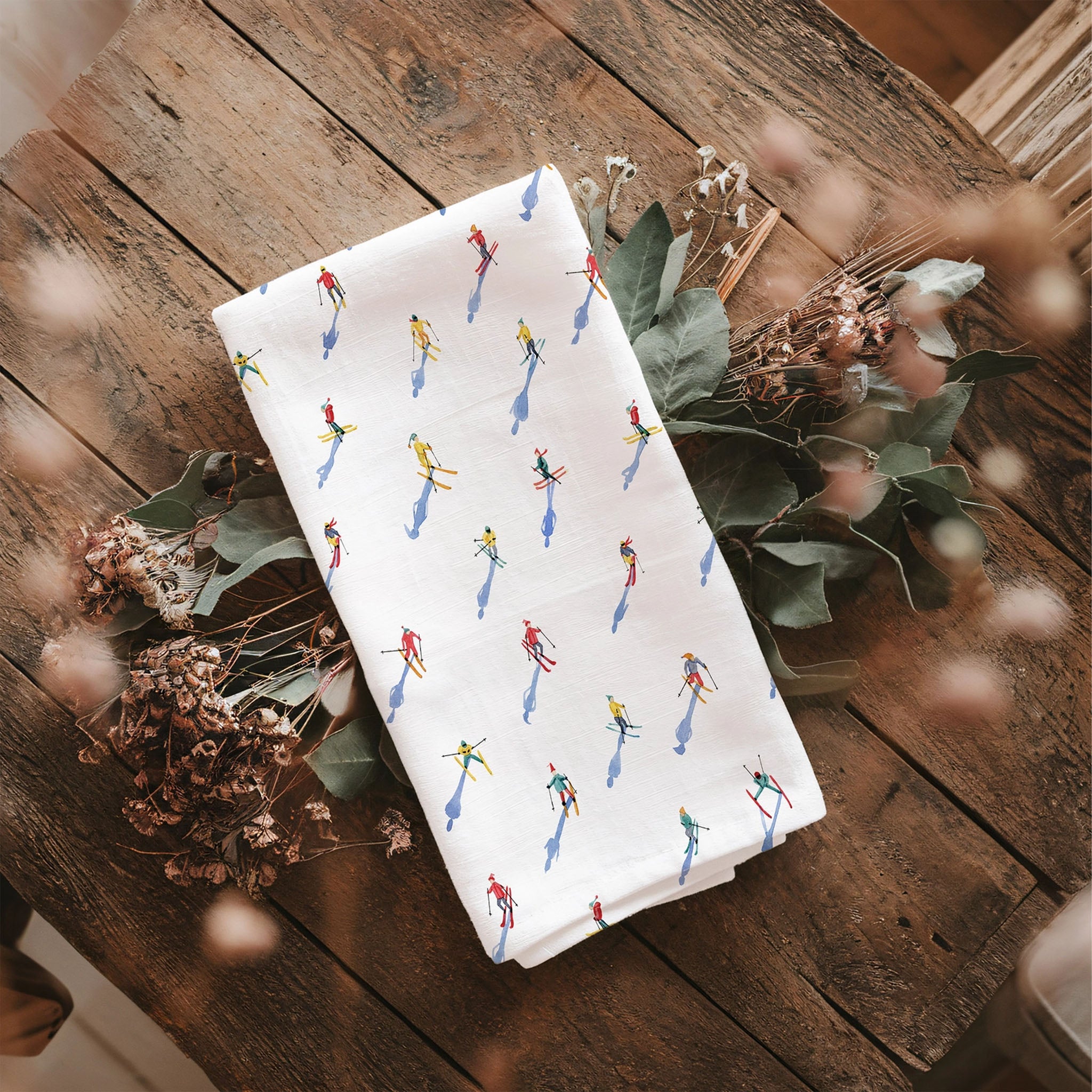 Skiers Tea Towel on a kitchen table at Addison West
