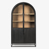Arched top black wood cabinet with iron base and honey wood interior on a white background