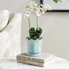 Small Maline Footed Pot in Blue on a table at Addison West
