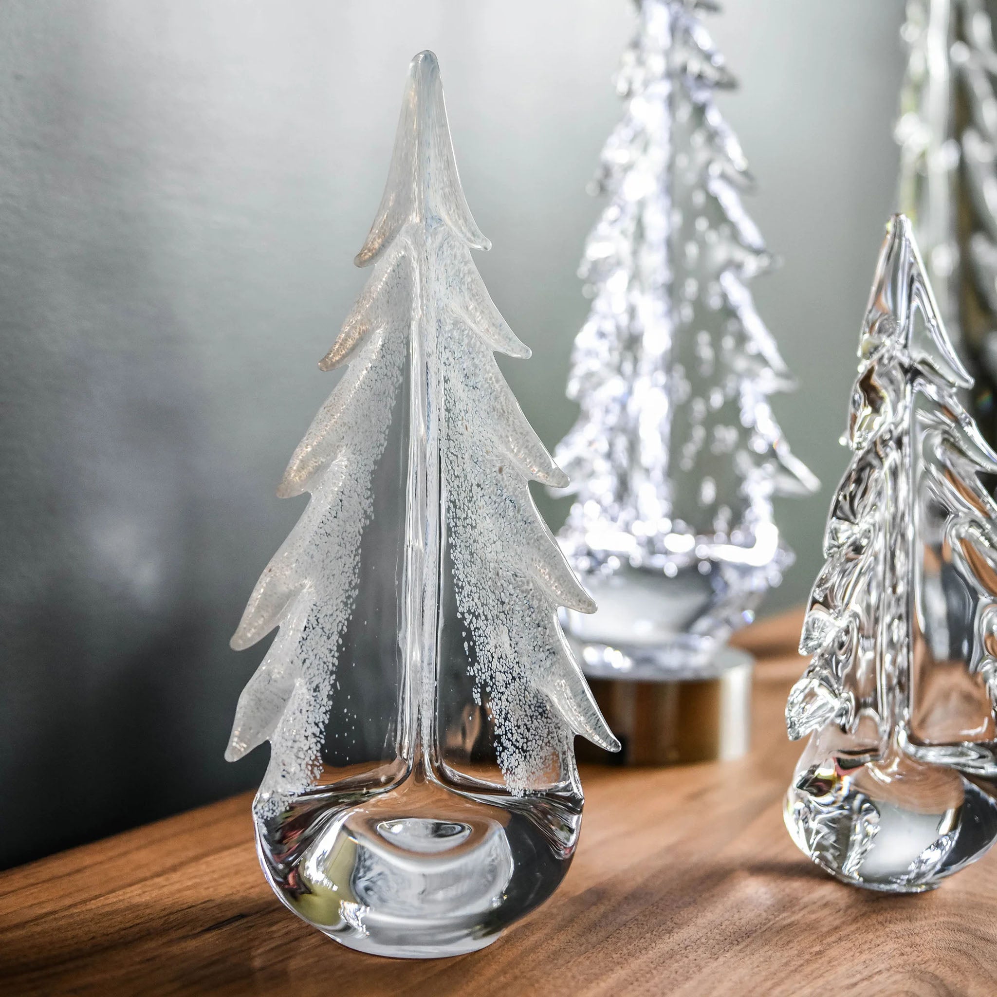 Simon Pearce Snowy Branches Evergreen Glass Trees on a table at Addison West