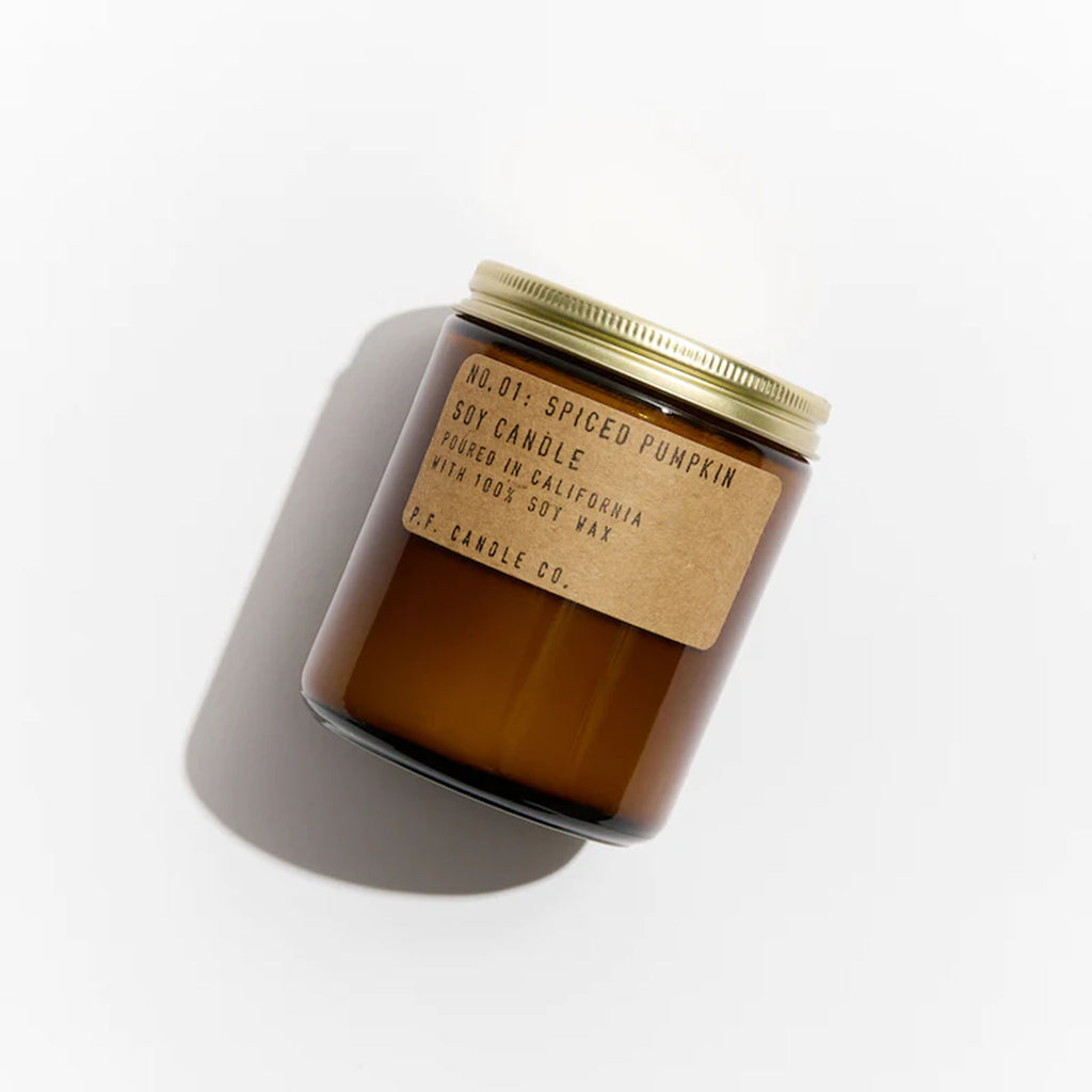 Brown jar of PF Candle Spiced Pumpkin Candle on a white background