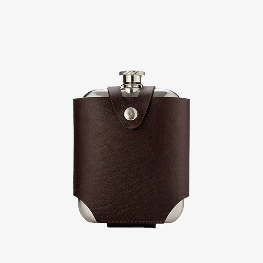 Stainless steel flask wrapped in vegan leather on a white background