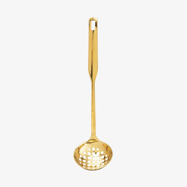 Stainless ladle with brass finish on a white background