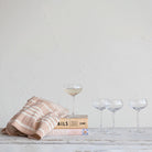 Fluted Champagne Coupe on a table at Addison West