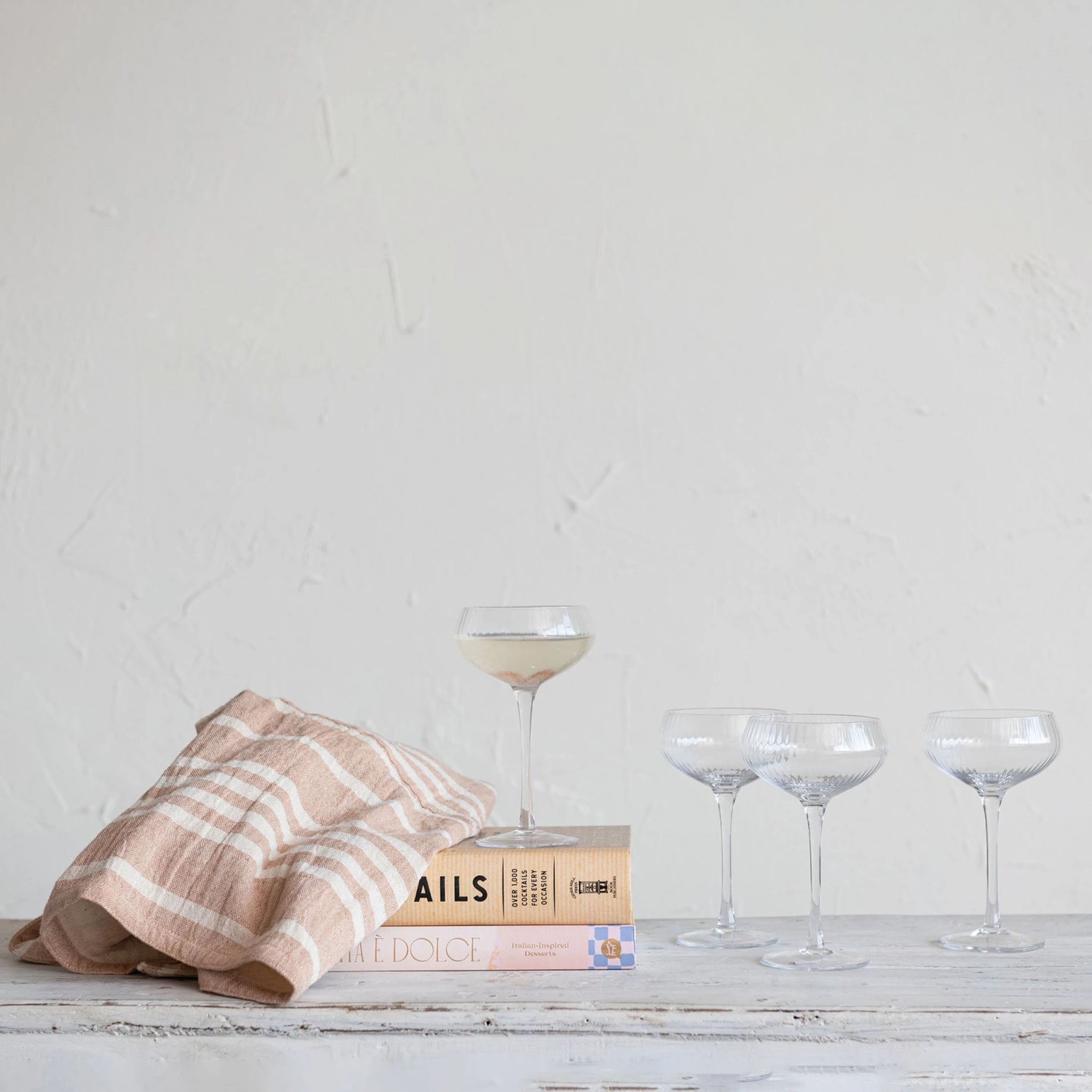 Fluted Champagne Coupe on a table at Addison West