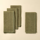 Stonewash Forest Linen Napkins, Set of 4 on a beige background at Addison West