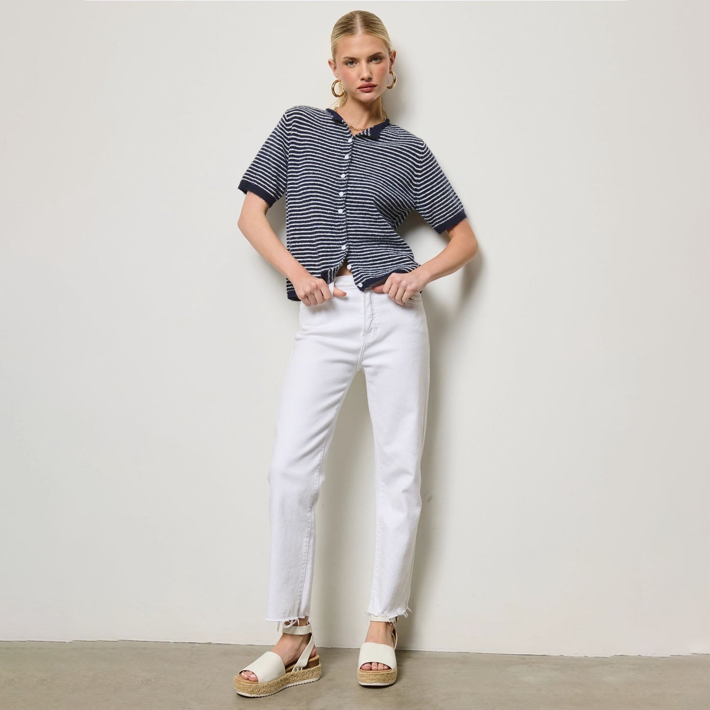 Striped Short Sleeve Button Cardigan in Navy shown on model on plain background.