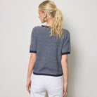 Striped Short Sleeve Button Cardigan in Navy shown on model on plain background.