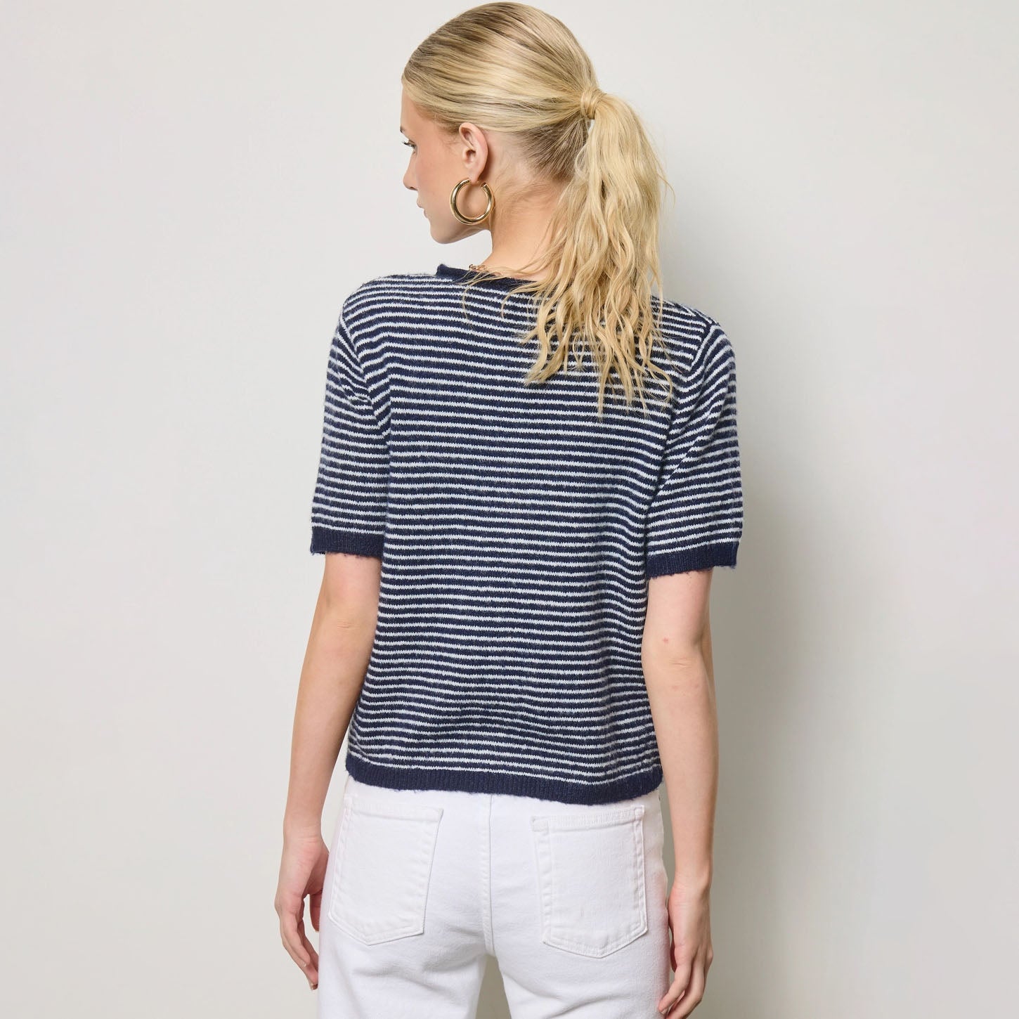 Striped Short Sleeve Button Cardigan in Navy shown on model on plain background.