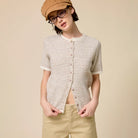 Striped Short Sleeve Button Cardigan in Taupe shown on model on plain background.
