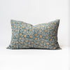 Blue and yellow printed lumbar pillow on a white backrgound