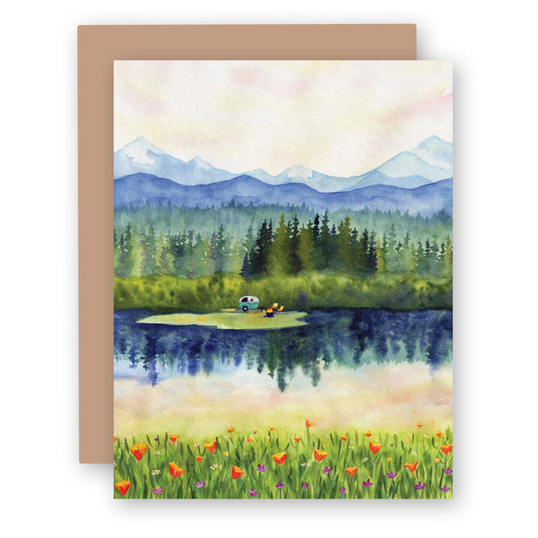 Water color greeting card with woods and mountains and small camper 