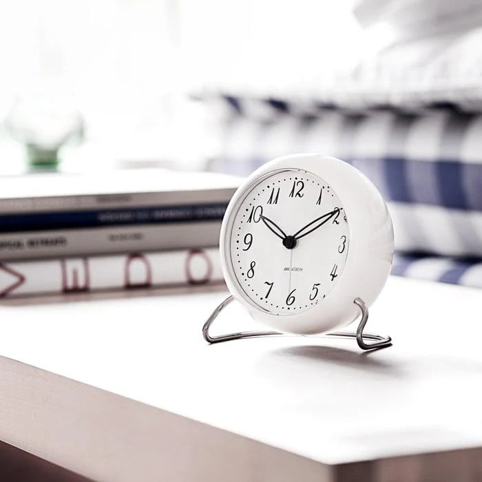 Arne Jacobsen LK Table Clock in White on a table at Addison West