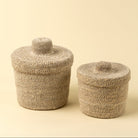 Tajine Seagrass Basket on a beige background at Addison West