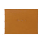 Tan Leather Bound Guest Book on white background at Addison West.