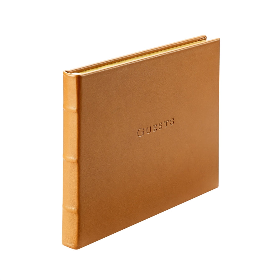 Tan Leather Bound Guest Book on white background at Addison West.
