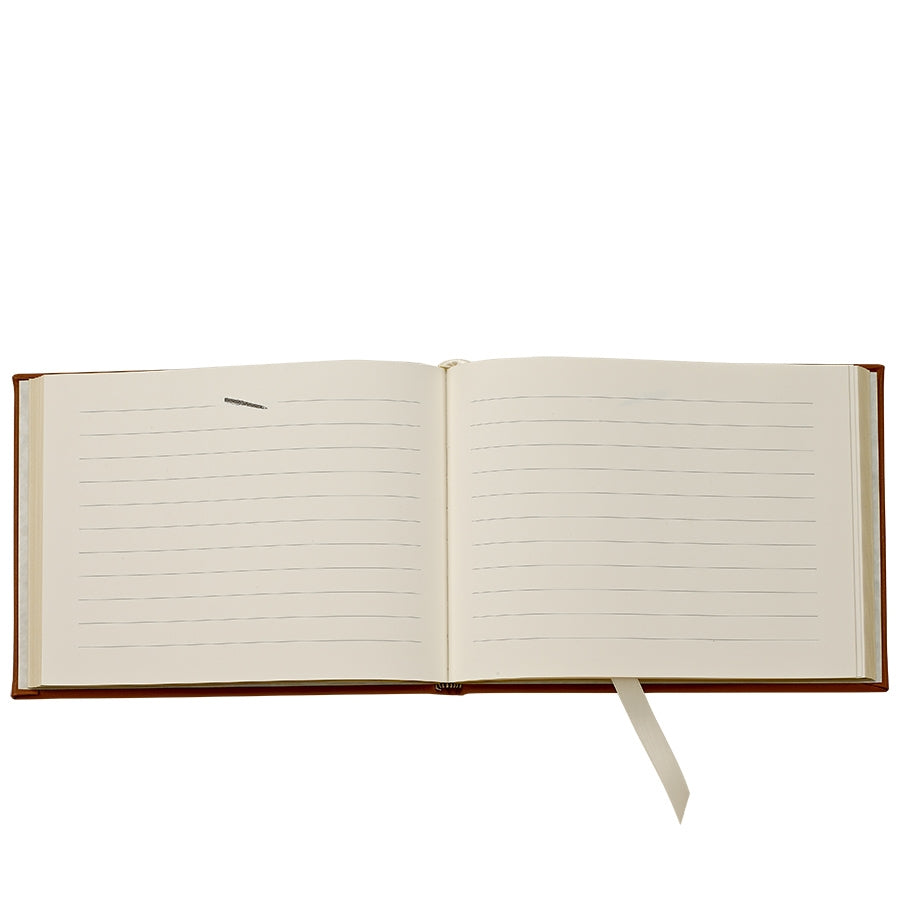 Tan Leather Bound Guest Book on white background at Addison West.