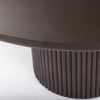 Close up of Terra Dark Brown Wood Round Fluted Dining Table on a white background