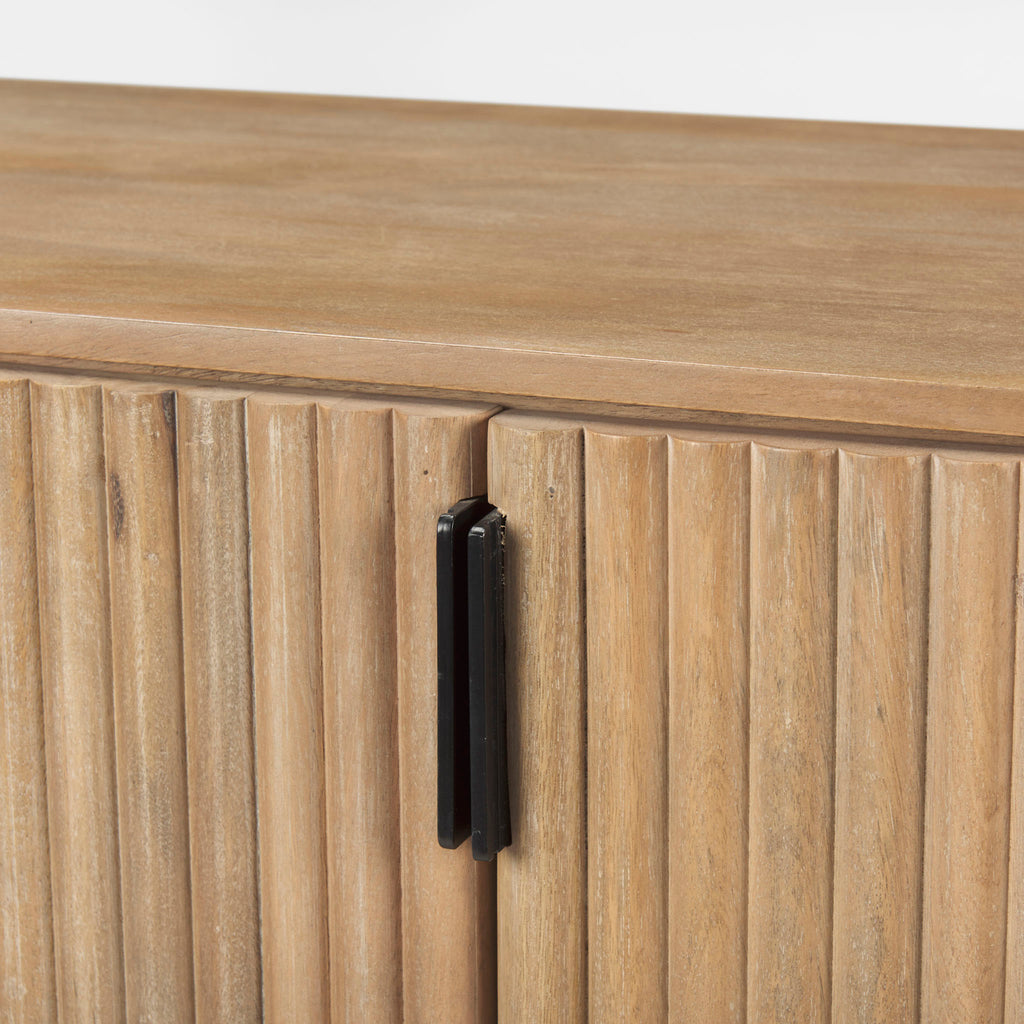 Natural reeded side board with four doors on a white background