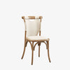 French bistro chair with canvas seat and canvas wrapped back finished with nail heads on a white background