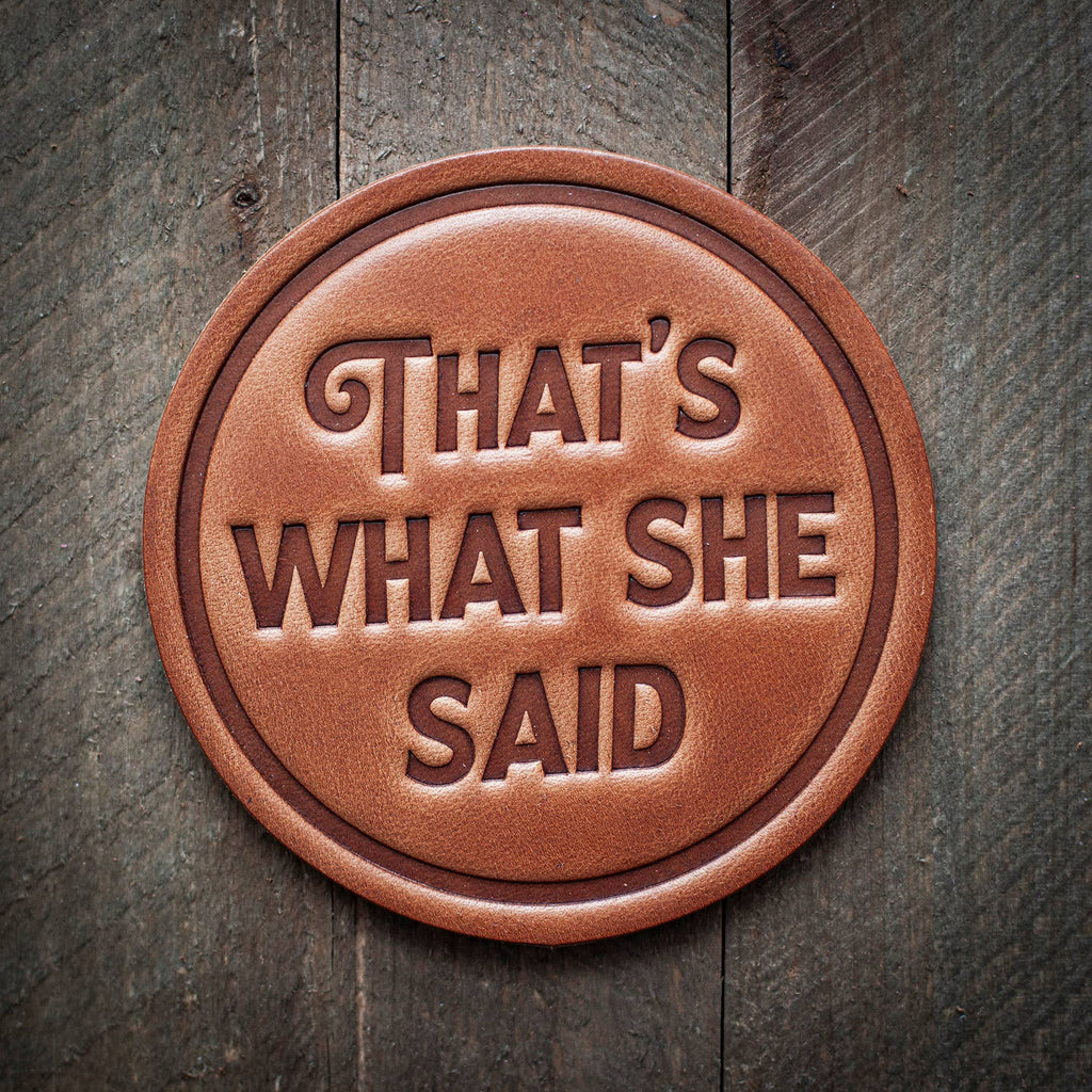 That's What She Said Leather Coaster on a wood surface
