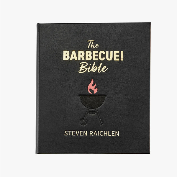 Leather bound version of the barbeque bible with black leather cover and weber grill embossed on front on a white background by Graphic Image