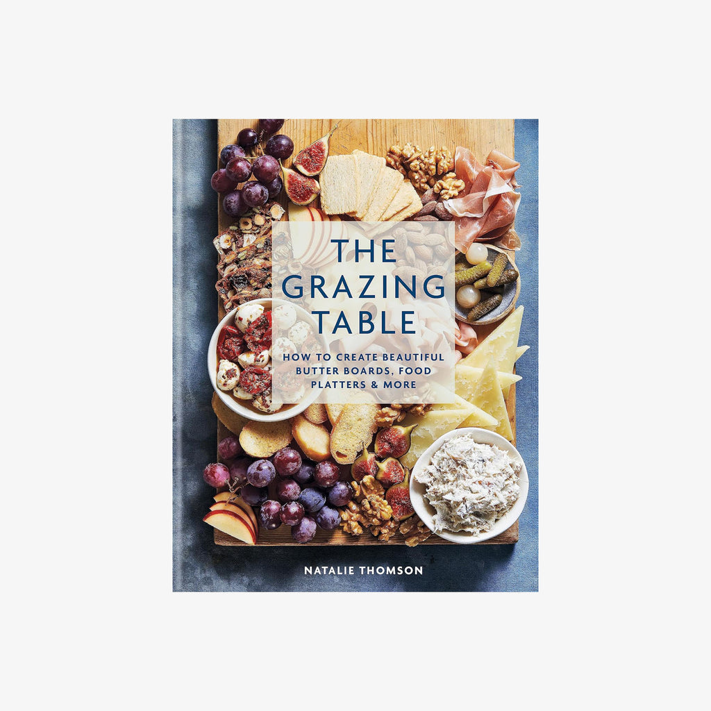 Front cover of book titled 'The Grazing Table' with image of cheeseboard on a white background