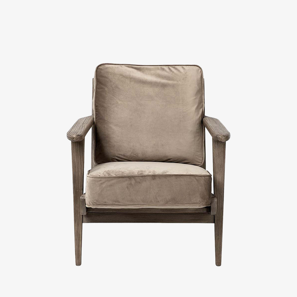 Wood arm chair with dark brown stain and olive velvet removable cushions on a white background