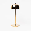 Gold Theta LED table lamp by Zafferano with small base and gold shade on a white background