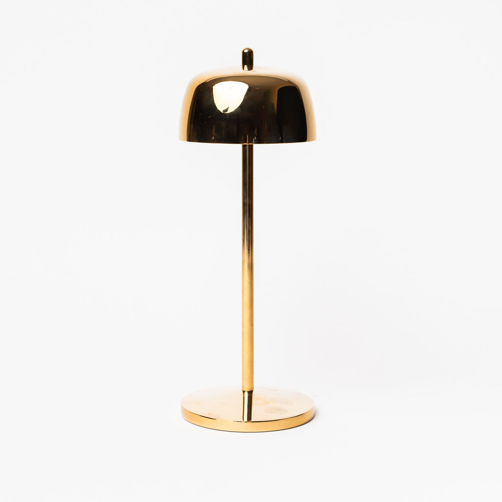 Gold Theta LED table lamp by Zafferano with small base and gold shade on a white background