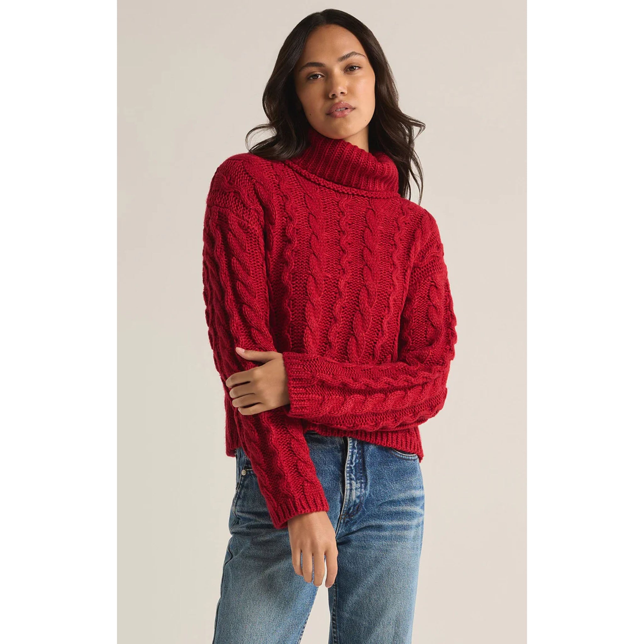 Model wearing Z Supply Tied To You Sweater in Haute Red in front of a neutral backdrop
