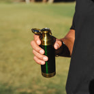 High Camp 9 oz. Torch Flask in British Racing Green with a model at Addison West