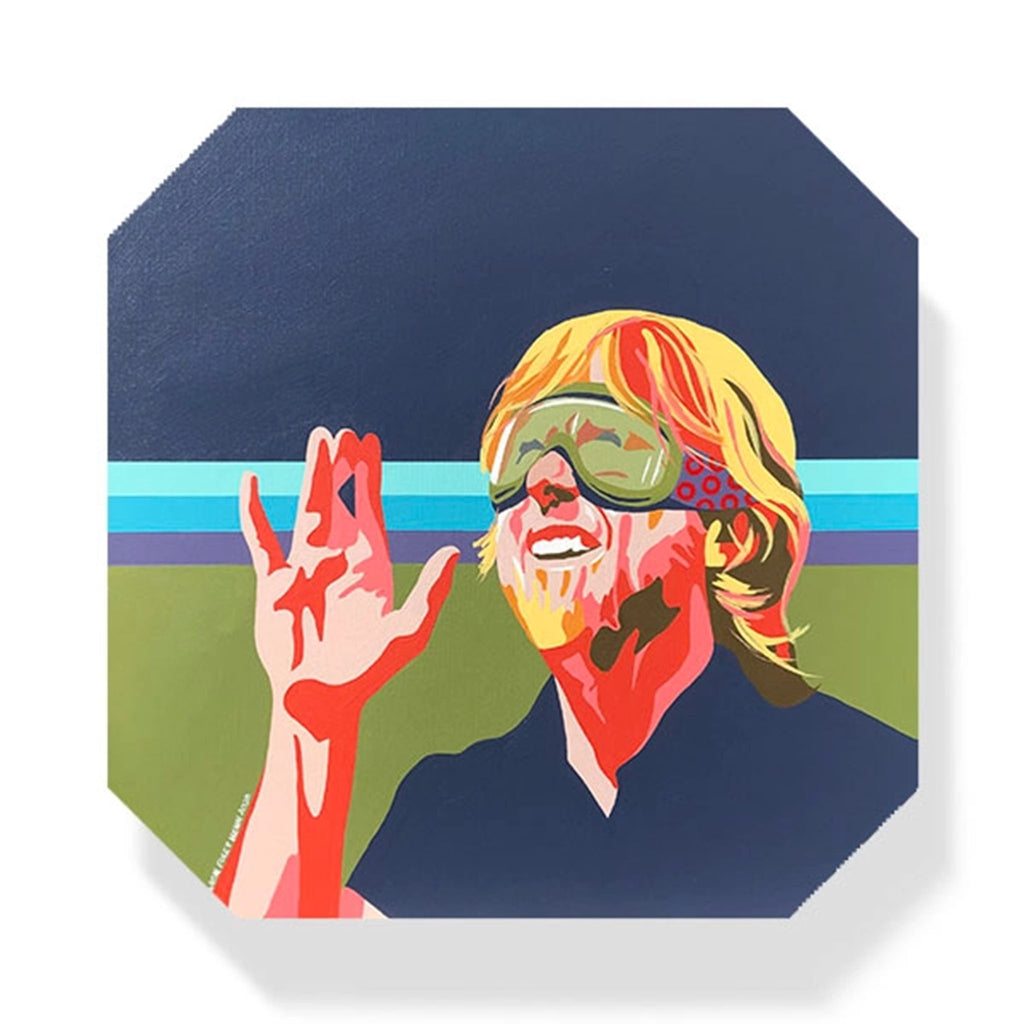 Square coaster with illustration of Trey Anastasio wearing ski goggles by Shannon Henn on a white background