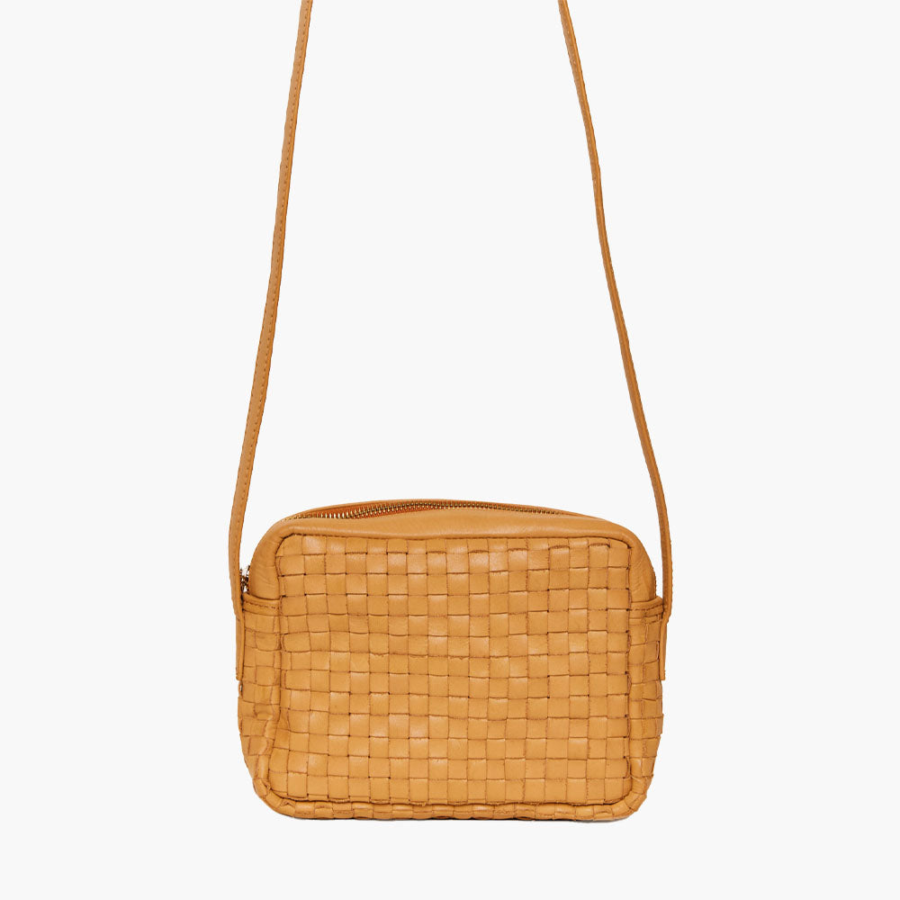 Able Valerie woven crossbody bag in cognac on a white background