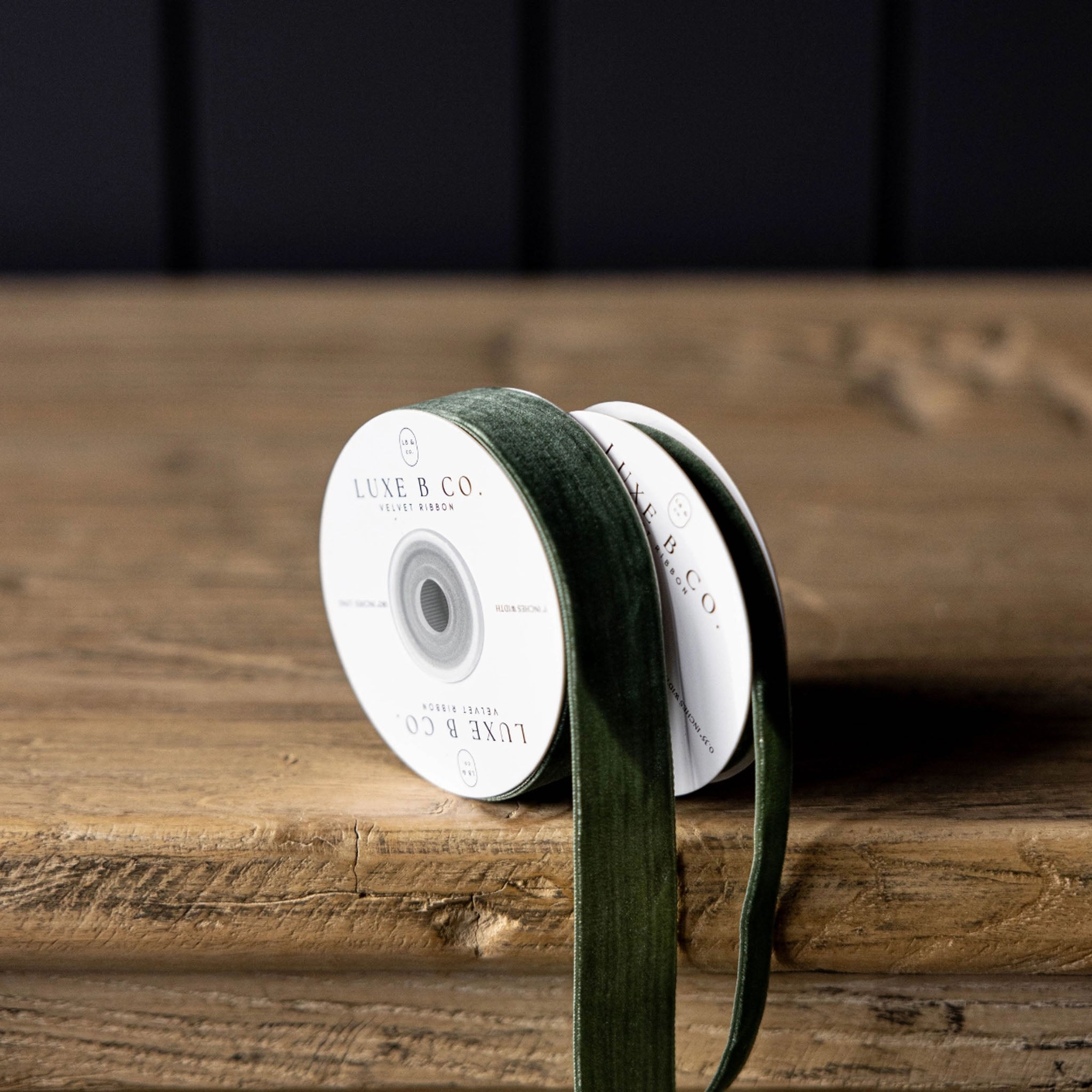 Velvet Ribbon in Forest Green, Medium on a wood table at Addison West